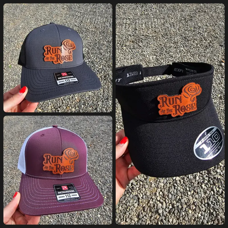 Run at the Rose hats and visor in charcoal and maroon with rust leather patches