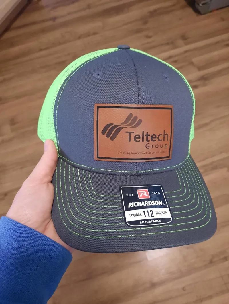 Charcoal and neon green Richardson 112 with a rust leather Teltech Group patch