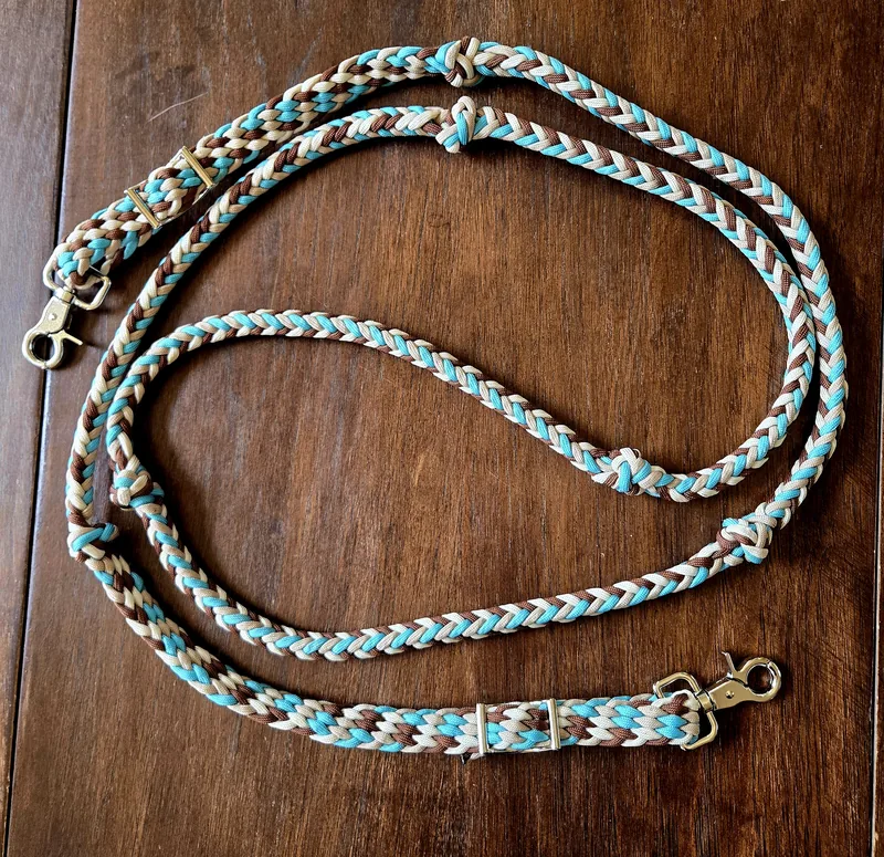 Desert Turquoise braided reins coiled on a wooden table